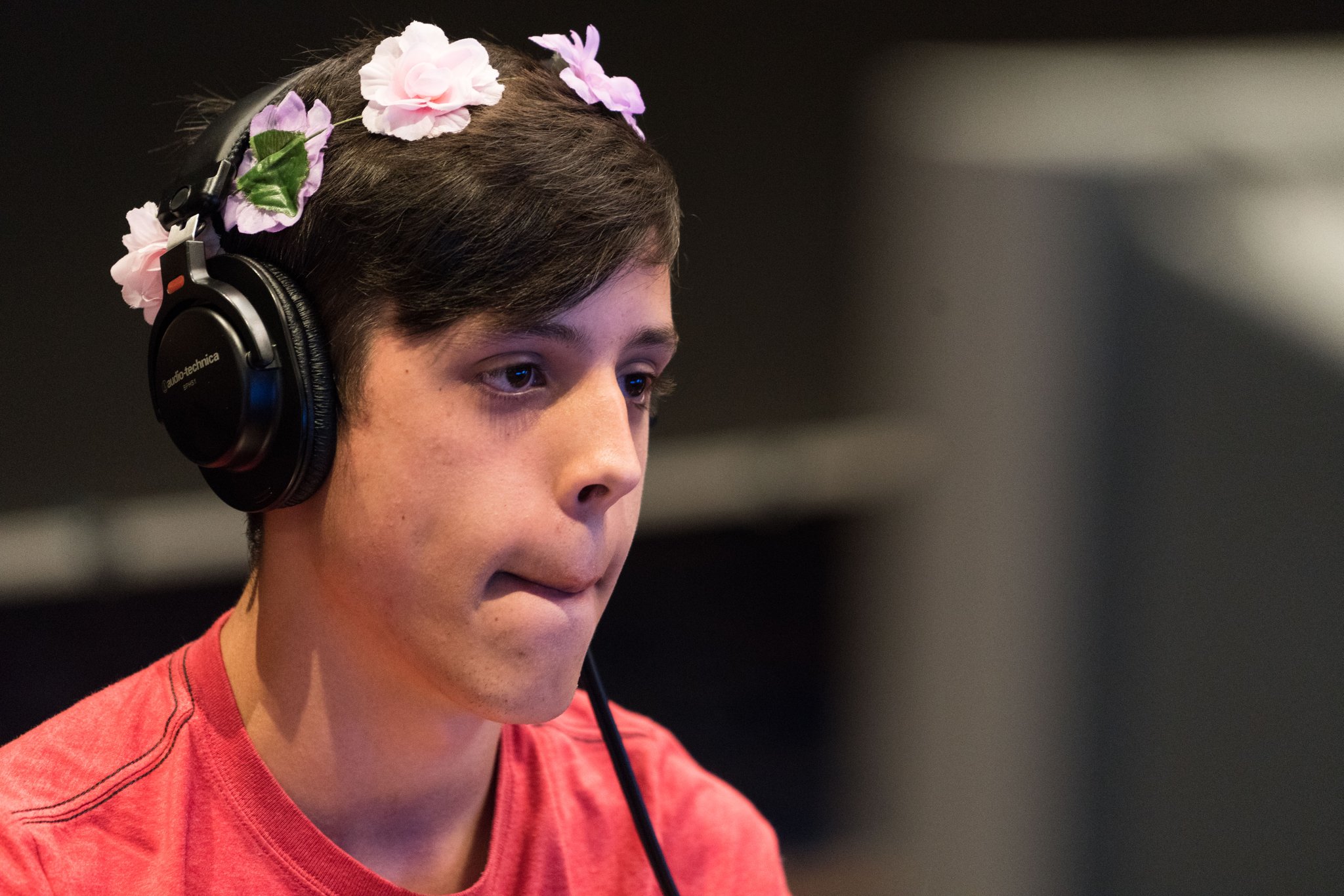 A focused speedrunner wearing headphones during a Summer Games Done Quick marathon.